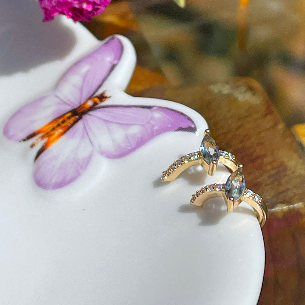 Piercing with blue topaz and white CZ
