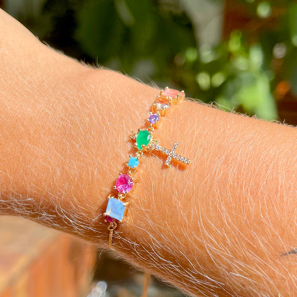Adjustable bracelet with colored crystals and hanging stud cross