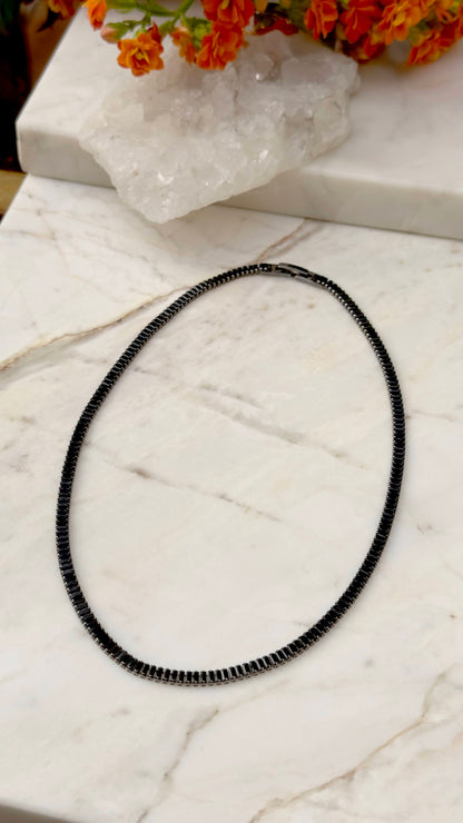 Malleable baguette tennis necklace in dark rhodium