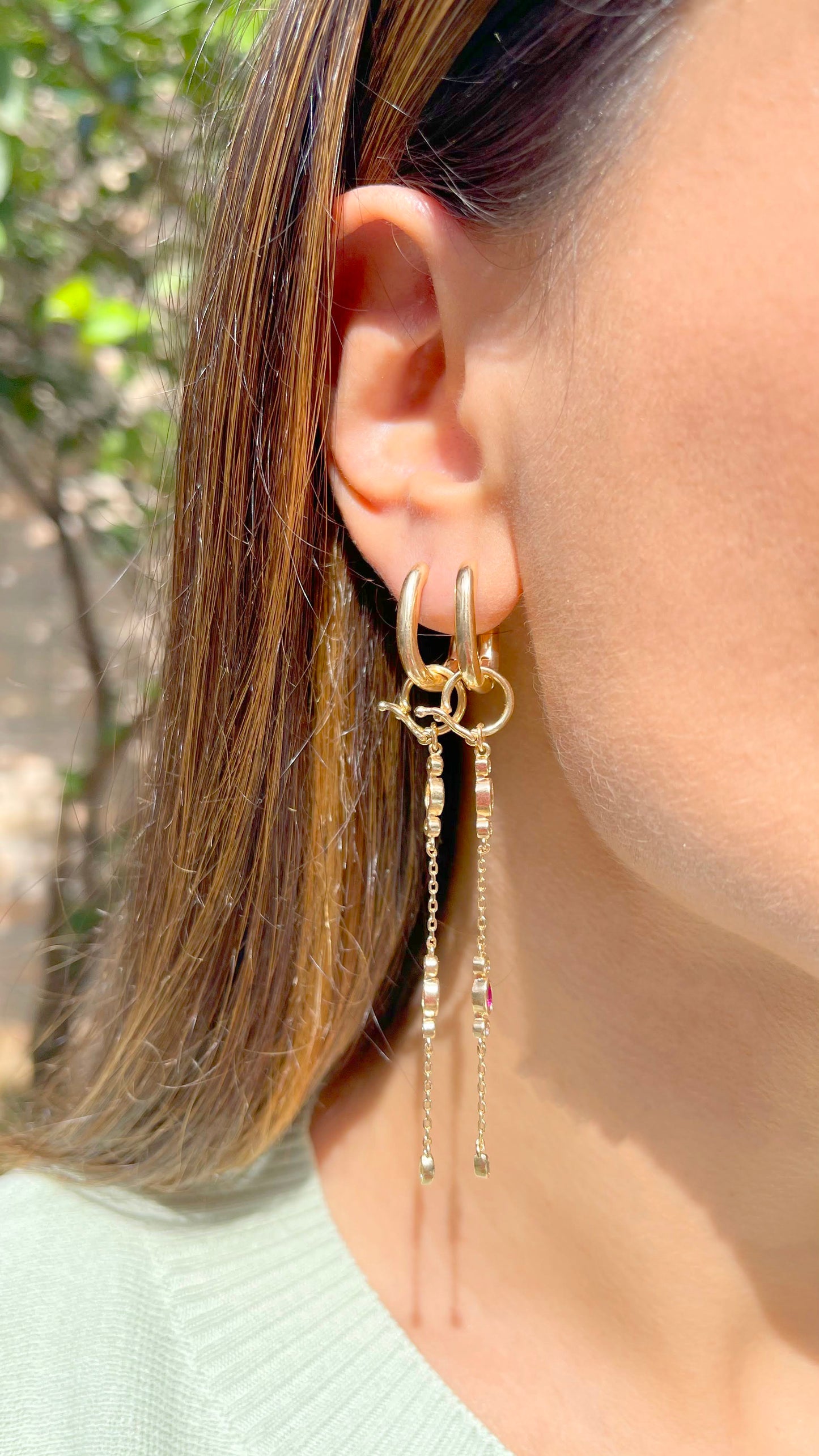 Hoop earring with hanging chain and colorful crystals